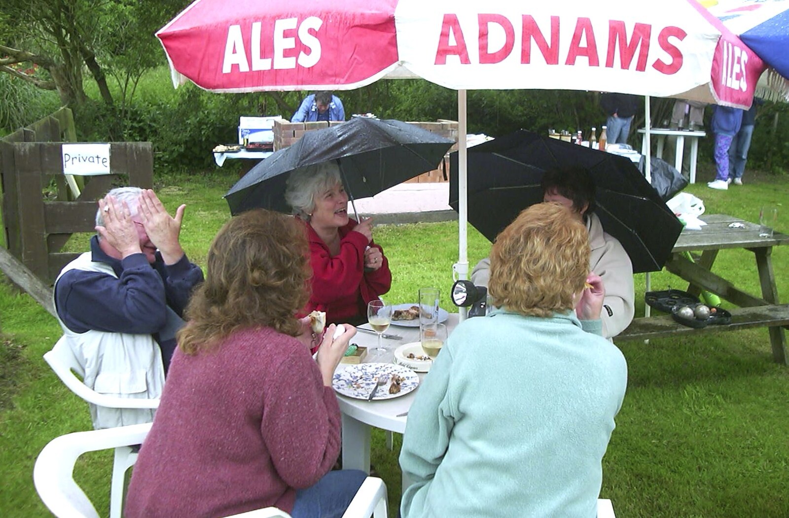A Rainy Barbeque at the Swan Inn, Brome, Suffolk - 15th June 2002: Bomber Langdon hides up