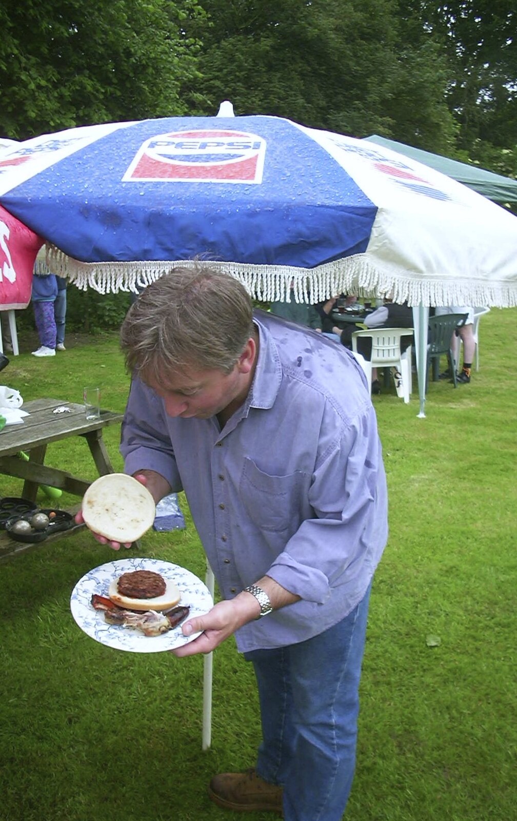 A Rainy Barbeque at the Swan Inn, Brome, Suffolk - 15th June 2002: Nigel shows off his lunch