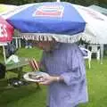 Nigel's got a burger and a low parasol, A Rainy Barbeque at the Swan Inn, Brome, Suffolk - 15th June 2002