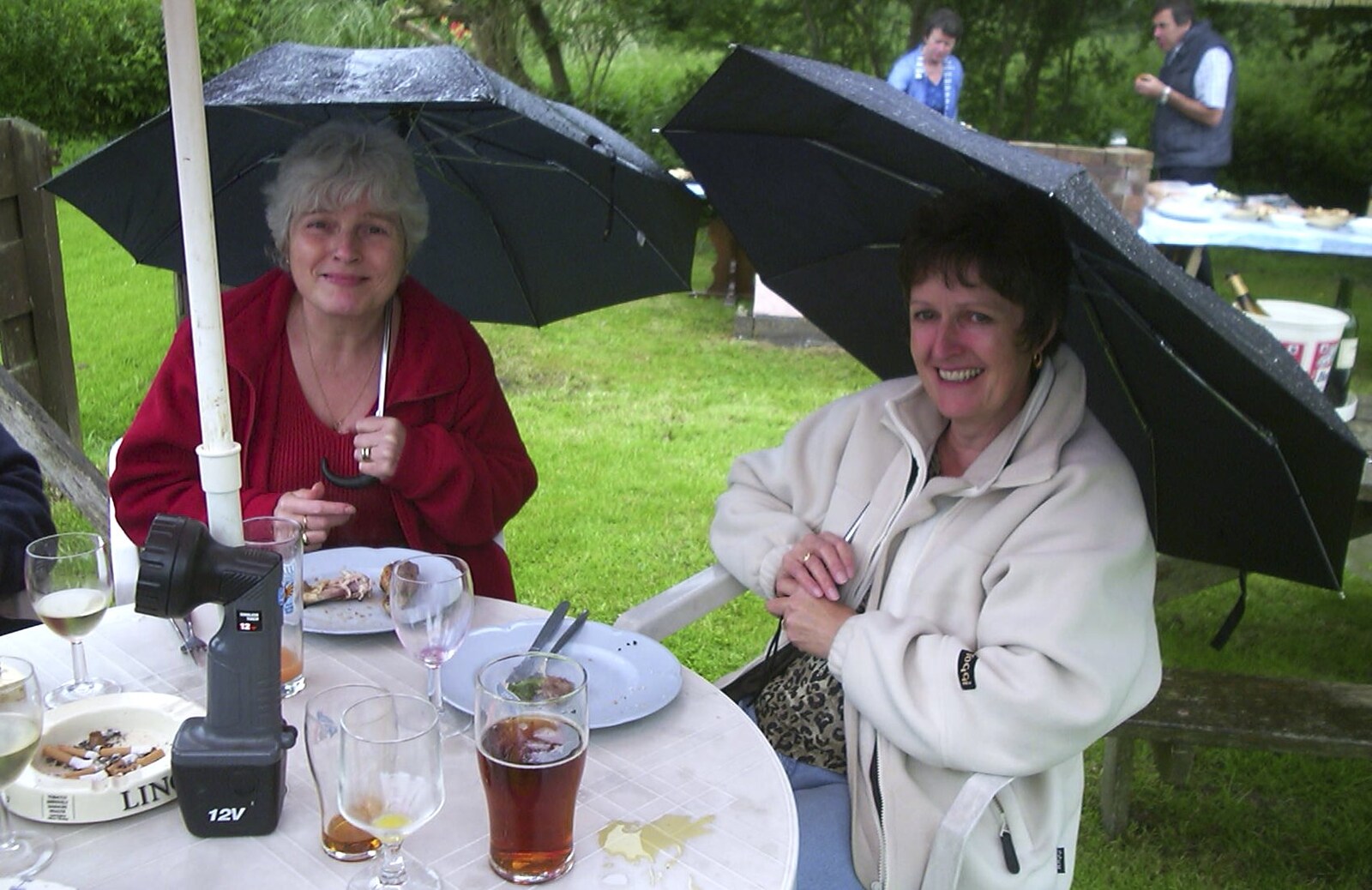 A Rainy Barbeque at the Swan Inn, Brome, Suffolk - 15th June 2002: Spam and Jill with umbrellas