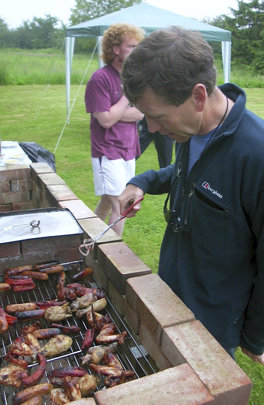 A Rainy Barbeque at the Swan Inn, Brome, Suffolk - 15th June 2002: Apple grabs some meat
