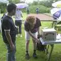 Wavy taps a beer, A Rainy Barbeque at the Swan Inn, Brome, Suffolk - 15th June 2002