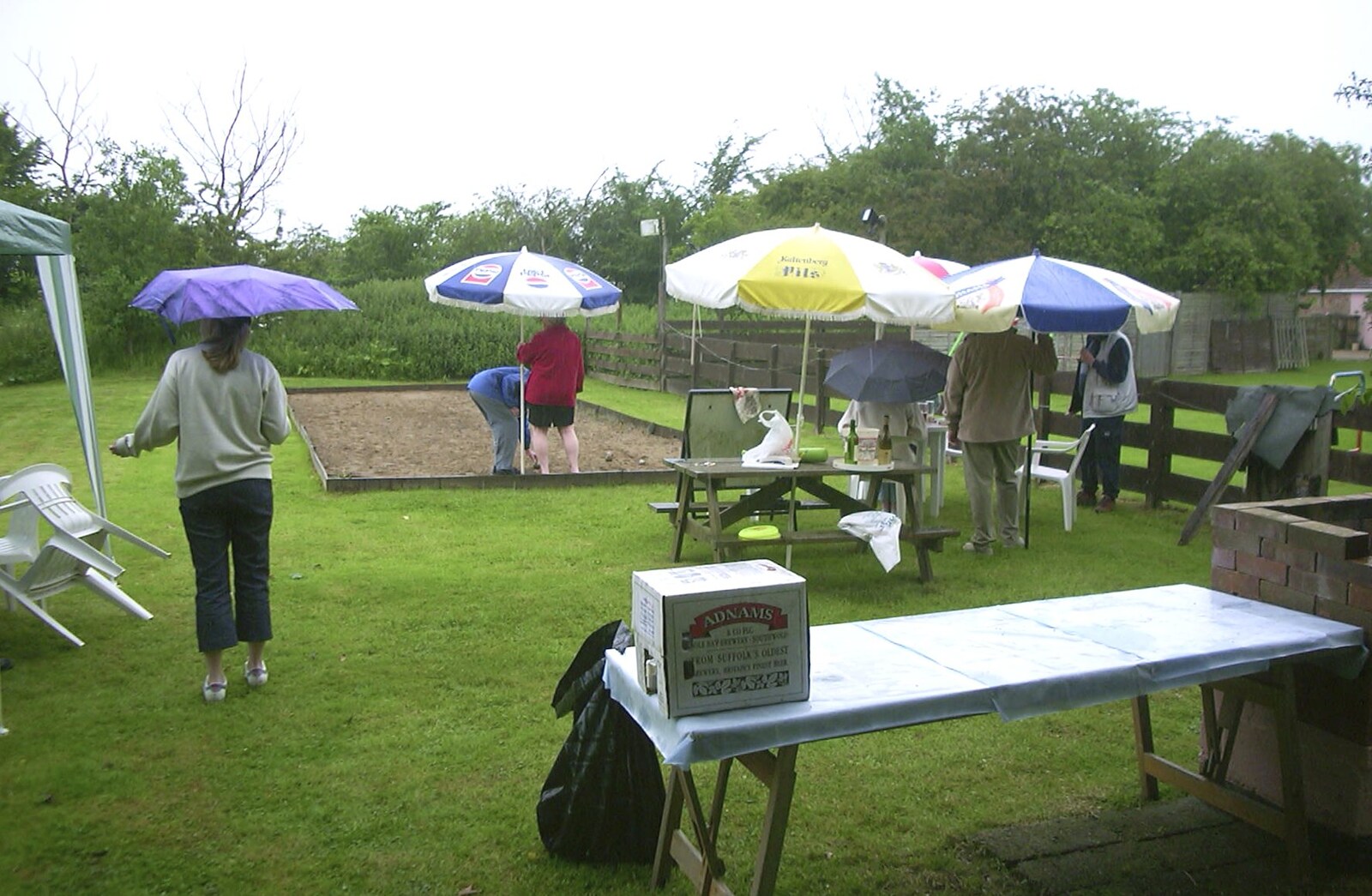 A Rainy Barbeque at the Swan Inn, Brome, Suffolk - 15th June 2002: Umbrellas everywhere