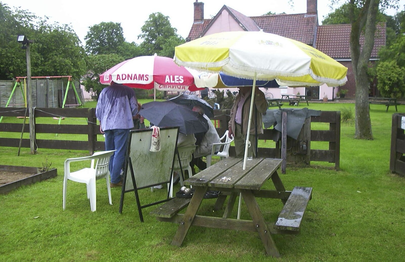 A Rainy Barbeque at the Swan Inn, Brome, Suffolk - 15th June 2002: The huddled masses