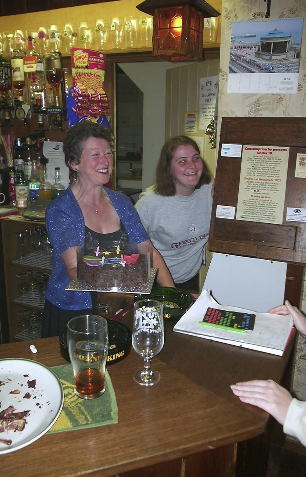 A Rainy Barbeque at the Swan Inn, Brome, Suffolk - 15th June 2002: Sylvia brings a birthday cake out