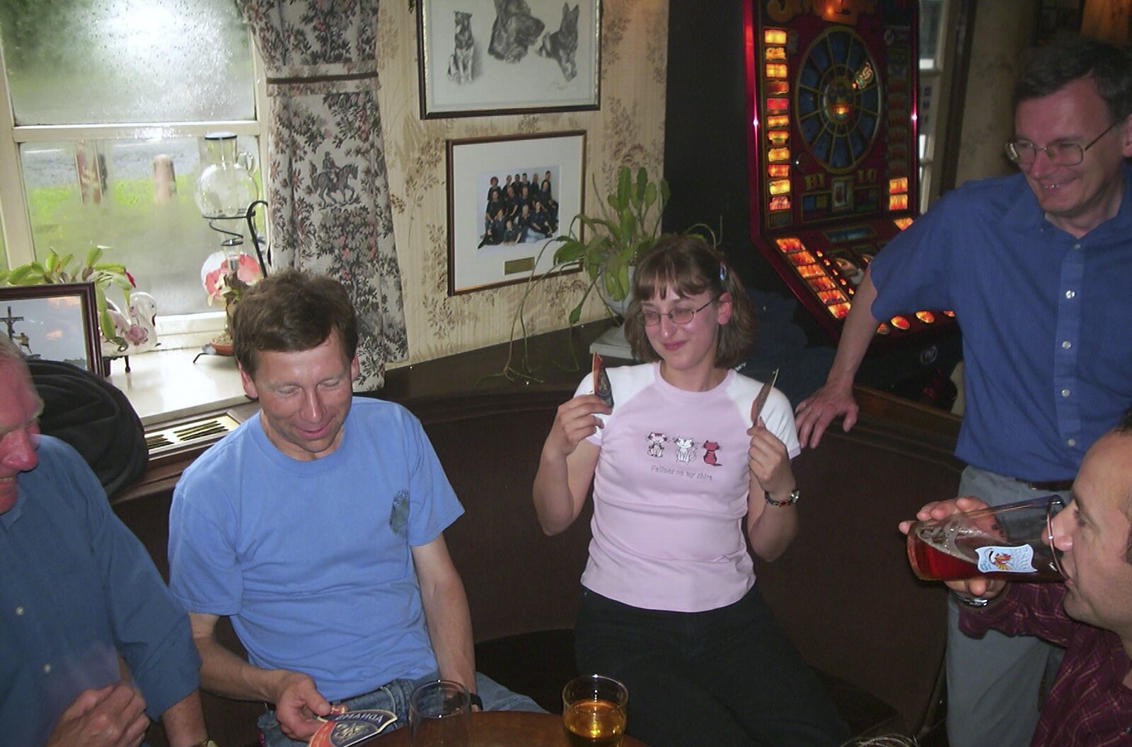 A Rainy Barbeque at the Swan Inn, Brome, Suffolk - 15th June 2002: Suey holds up some beer mats