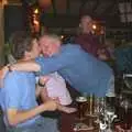 John Willy gives some hugs out, A Rainy Barbeque at the Swan Inn, Brome, Suffolk - 15th June 2002