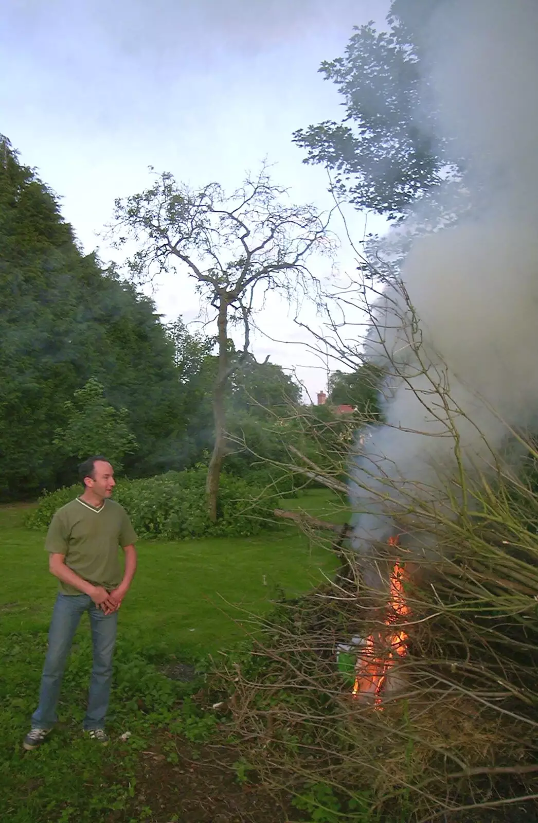 DH sets fire to a bonfire, from DH's BSCC Barbeque, The Old Post Office, Brome, Suffolk - 7th July 2002