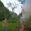 DH sets fire to a bonfire, DH's BSCC Barbeque, The Old Post Office, Brome, Suffolk - 7th July 2002