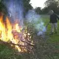 Marc hurls a plank of wood onto the fire, DH's BSCC Barbeque, The Old Post Office, Brome, Suffolk - 7th July 2002