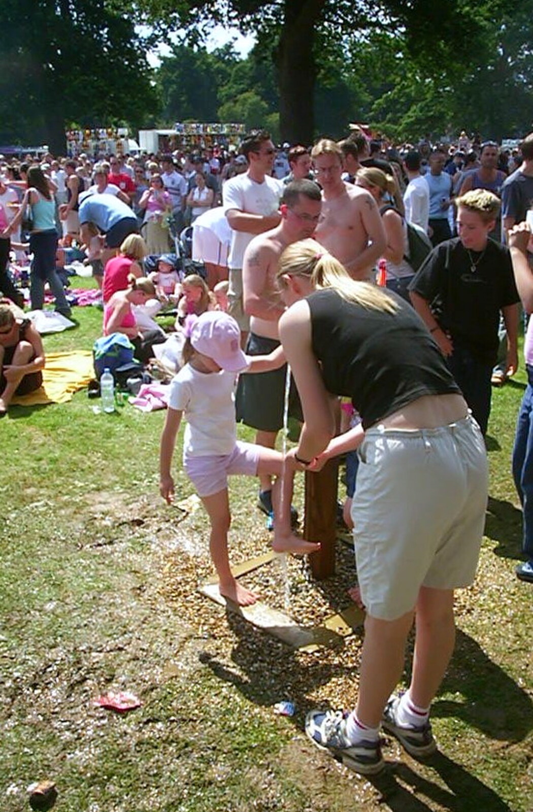 A girl gets her foot washed from Radio 1's One Big Sunday, Chantry Park, Ipswich - 14th July 2002
