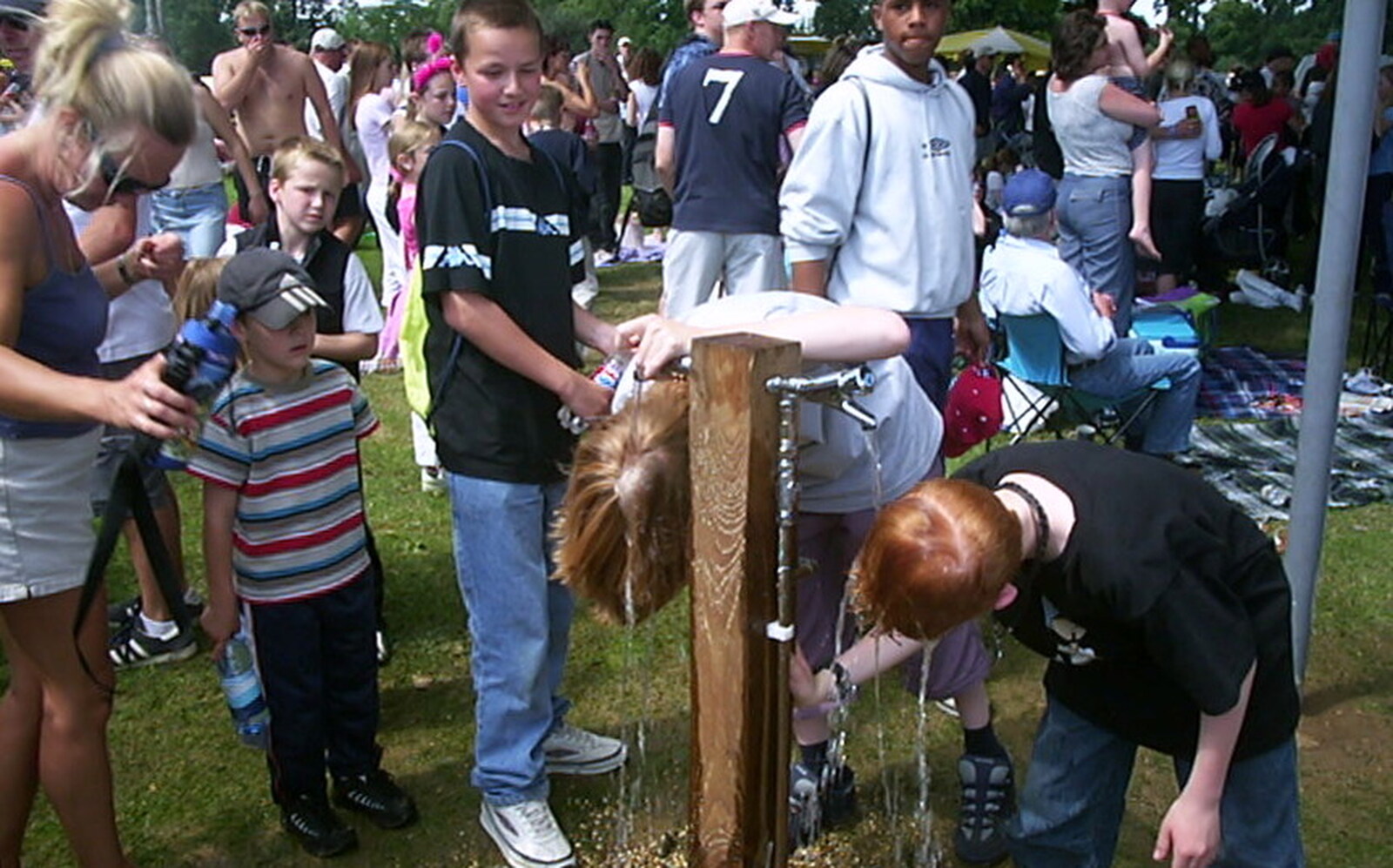 Some kids get a hair wash from Radio 1's One Big Sunday, Chantry Park, Ipswich - 14th July 2002