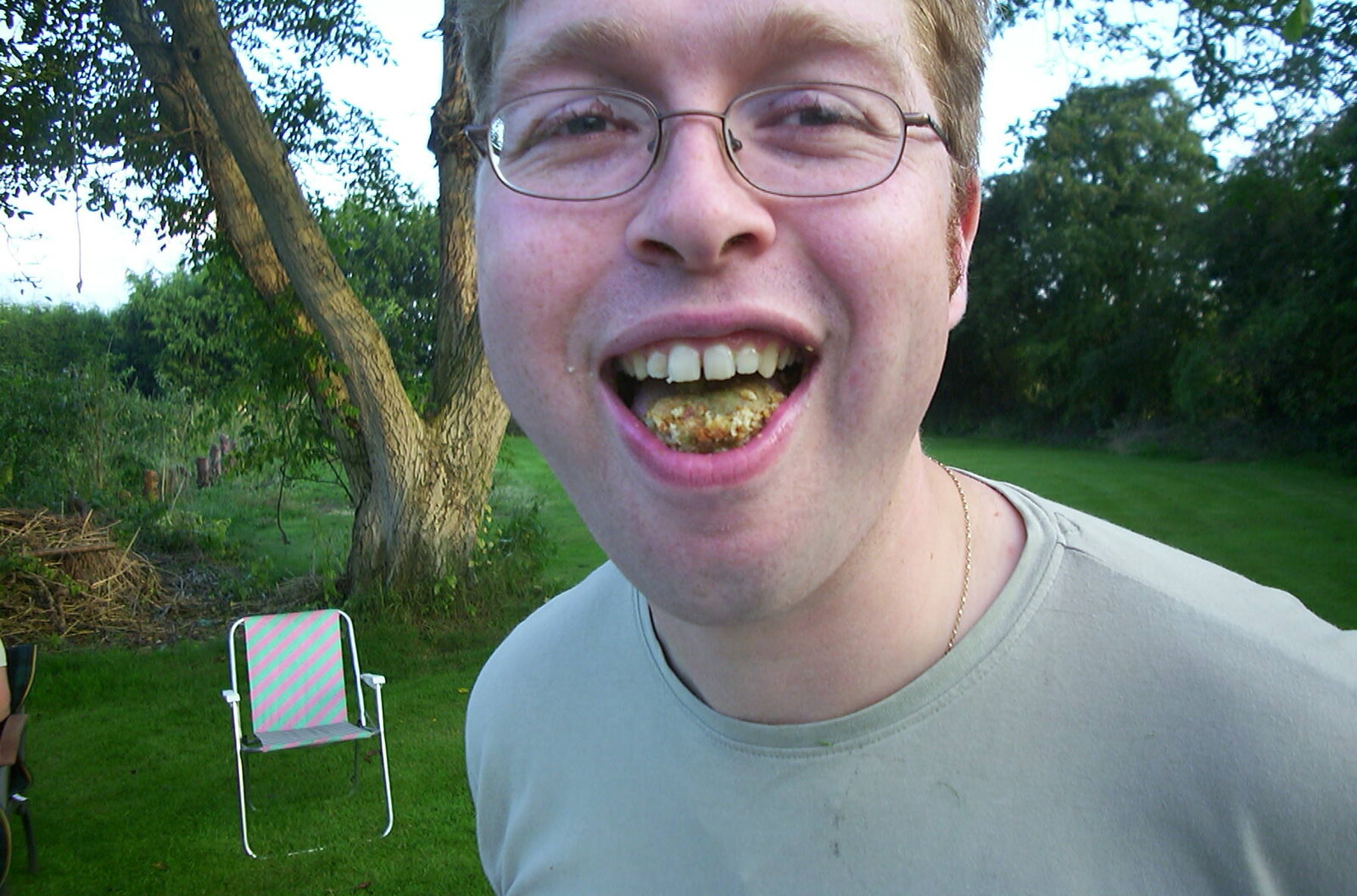 Marc shows off his mastications from Nosher's BSCC Barbeque, Brome, Suffolk - 3rd August 2002