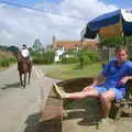 Nigel gets some sun as a horse trots by, A BSCC Splinter Group Camping Weekend, Theberton, Suffolk - 11th August 2002