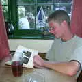 The Boy Phil reads a book, A BSCC Splinter Group Camping Weekend, Theberton, Suffolk - 11th August 2002