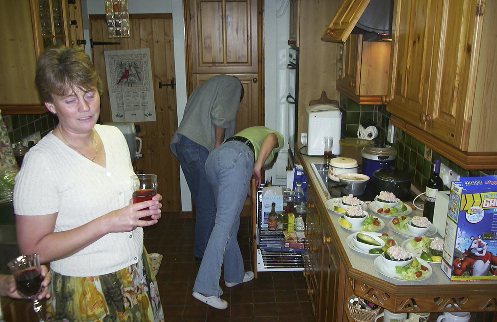 Pippa's in the kitchen with beer from Nigel and Jenny's Nosh-Up, Thrandeston, Suffolk - 18th August 2002
