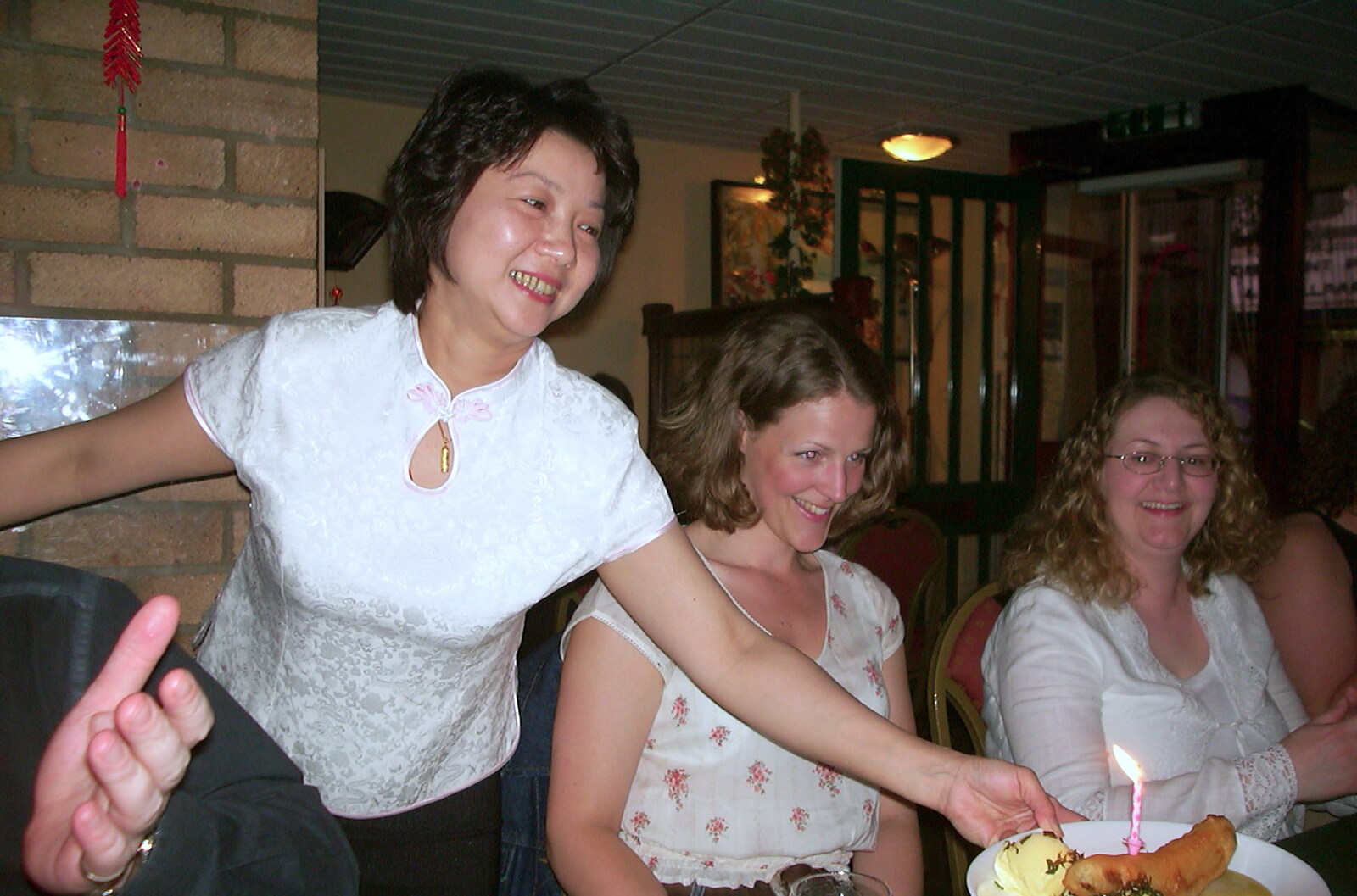 The restaurant owner brings over a novelty dessert from Michelle's 3G Lab Birthday, The Mews, St. Ives, Cambridgeshire - 20th September 2002