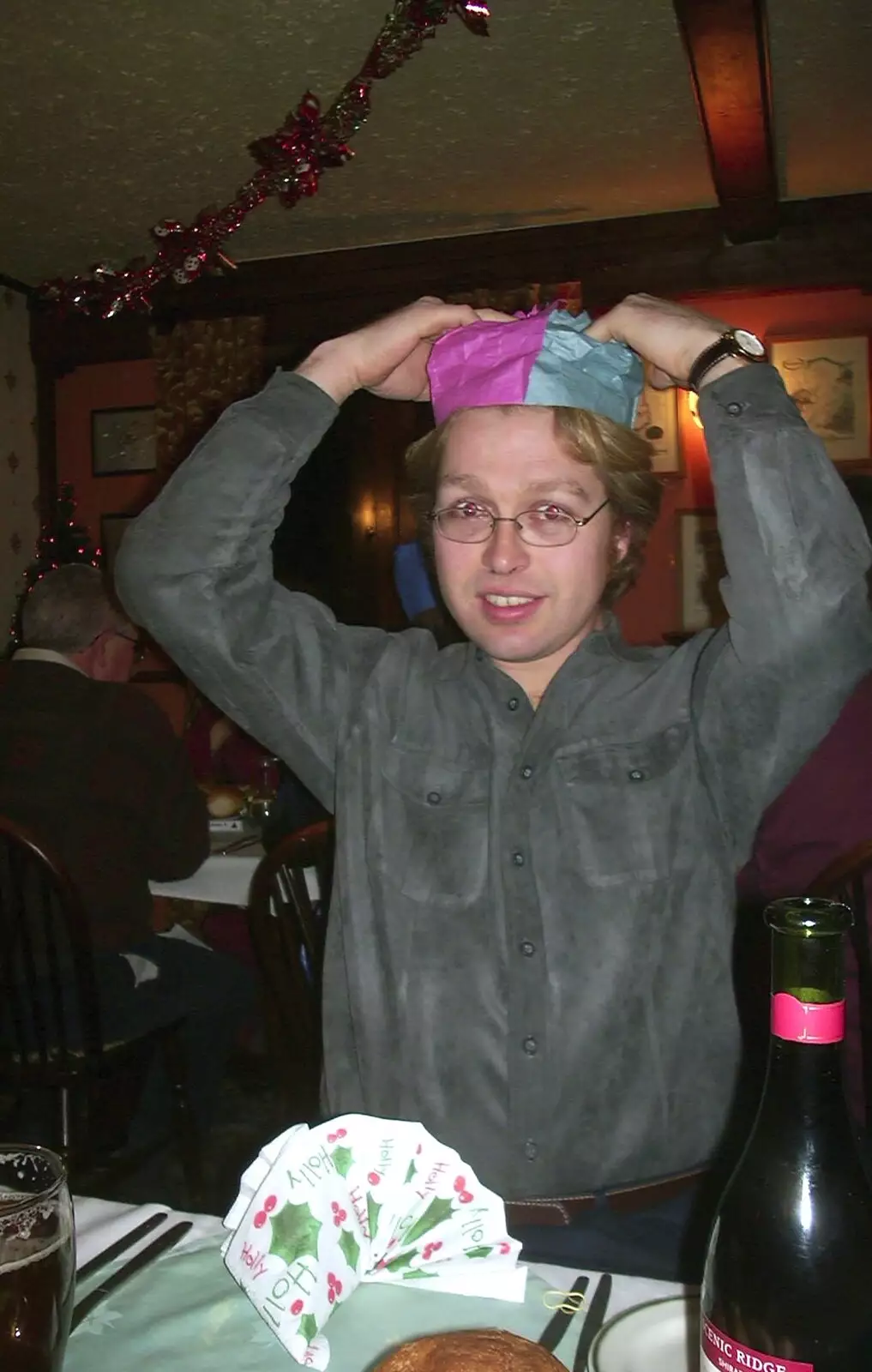 Marc sticks a paper hat on, from The BSCC Christmas Dinner, Brome Swan, Suffolk - 10th December 2002