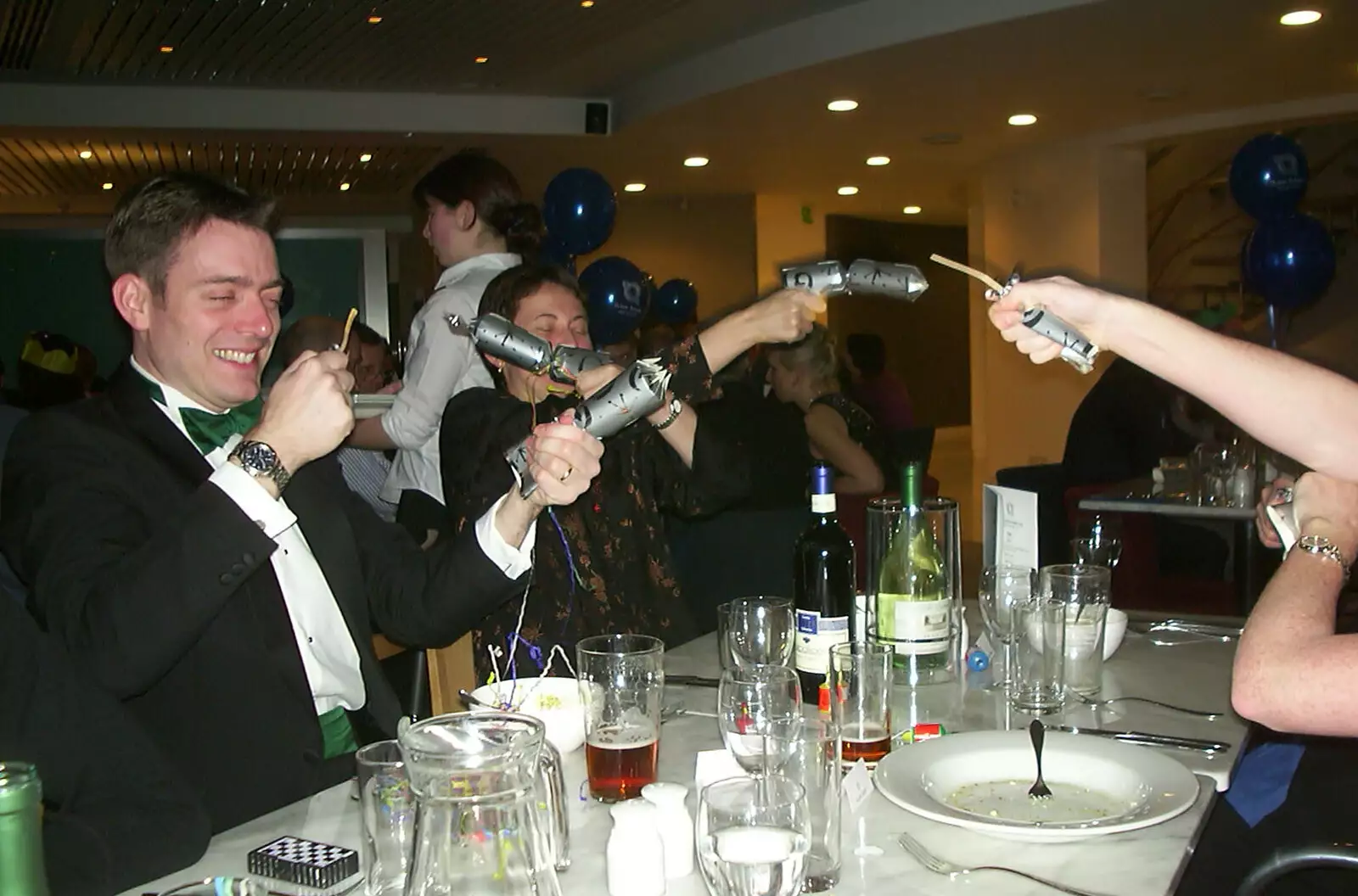 Christmas crackers are pulled, from 3G Lab Christmas Party, Q-Ton Centre, Cambridge - 23rd December 2002