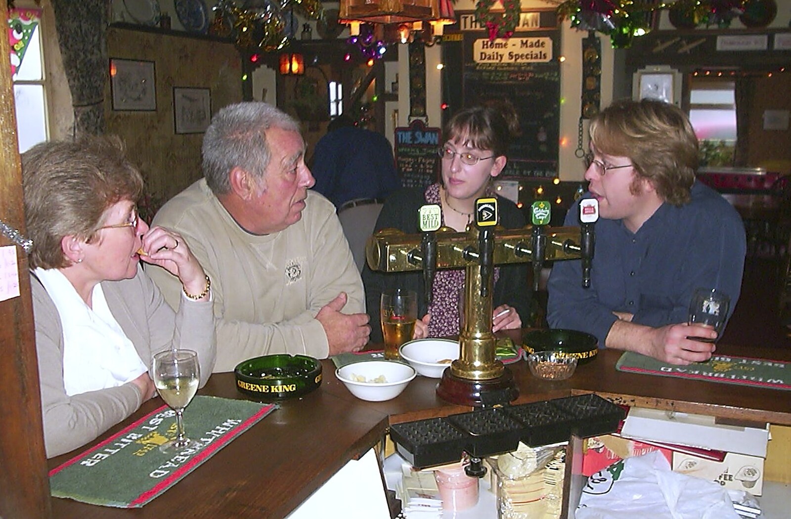 Marc's mum and dad chat to Suey and Marc from Christmas Day at Nosher's, Brome, Suffolk - 25th December 2002