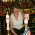 Syliva pulls a pint, New Year's Eve at the Swan Inn, Brome, Suffolk - 31st December 2002