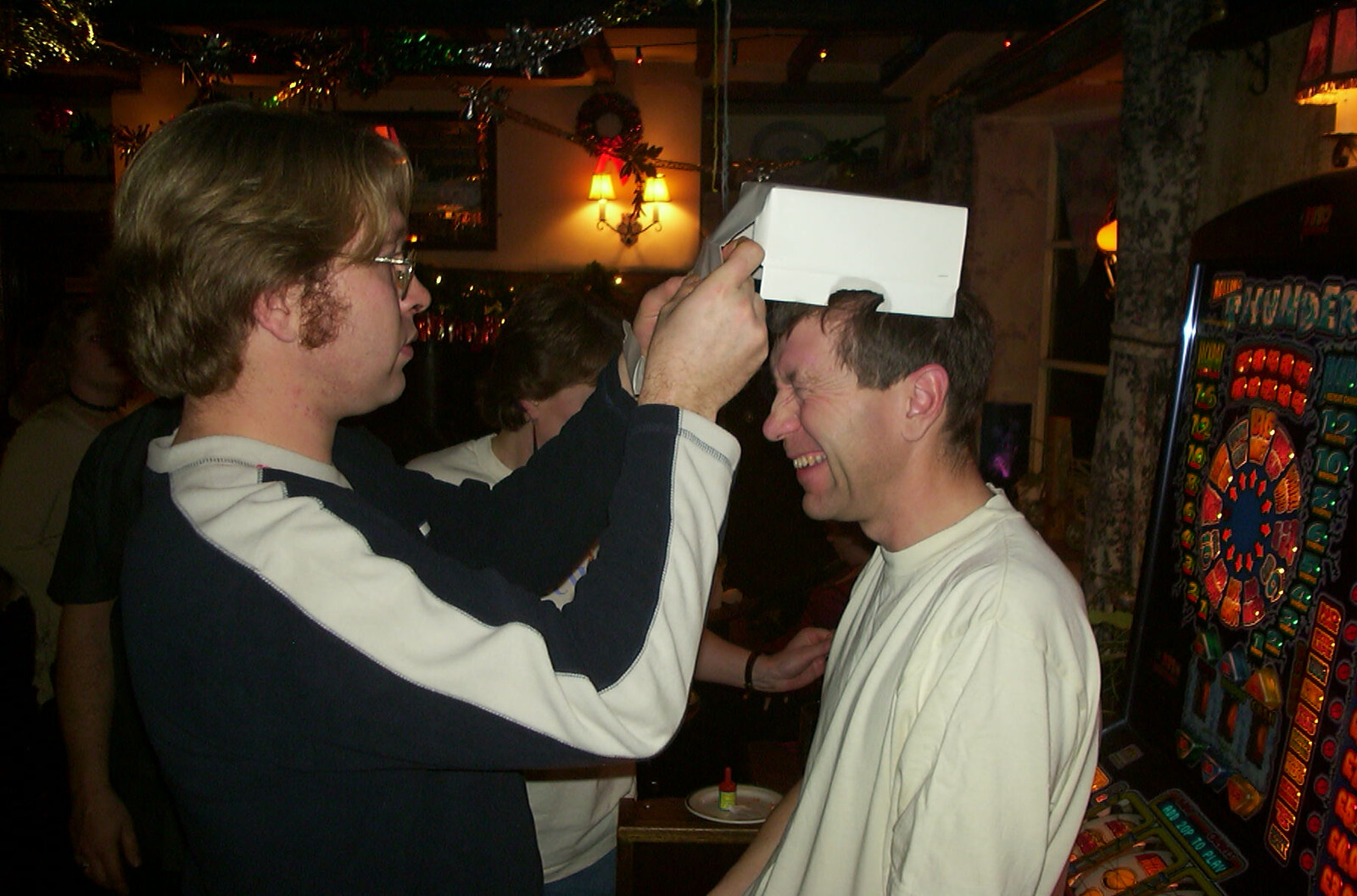New Year's Eve at the Swan Inn, Brome, Suffolk - 31st December 2002: Marc pokes at Apple's box hat
