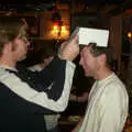 Marc pokes at Apple's box hat, New Year's Eve at the Swan Inn, Brome, Suffolk - 31st December 2002