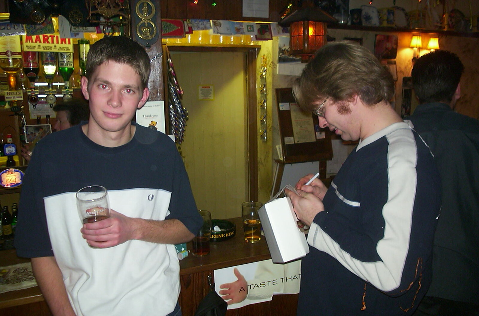 New Year's Eve at the Swan Inn, Brome, Suffolk - 31st December 2002: The Boy Phil looks up as Marc draws something