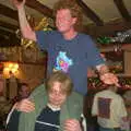 Marc gives Wavy a piggy-back, New Year's Eve at the Swan Inn, Brome, Suffolk - 31st December 2002