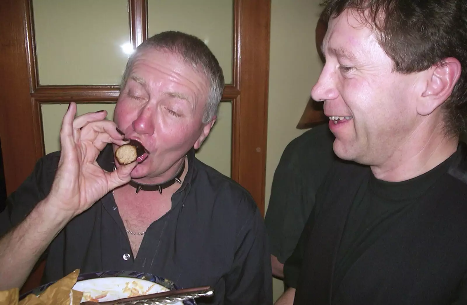 John Willy chomps on a sausage, from Anne's Gothic Night, Thorndon - 25th January 2003