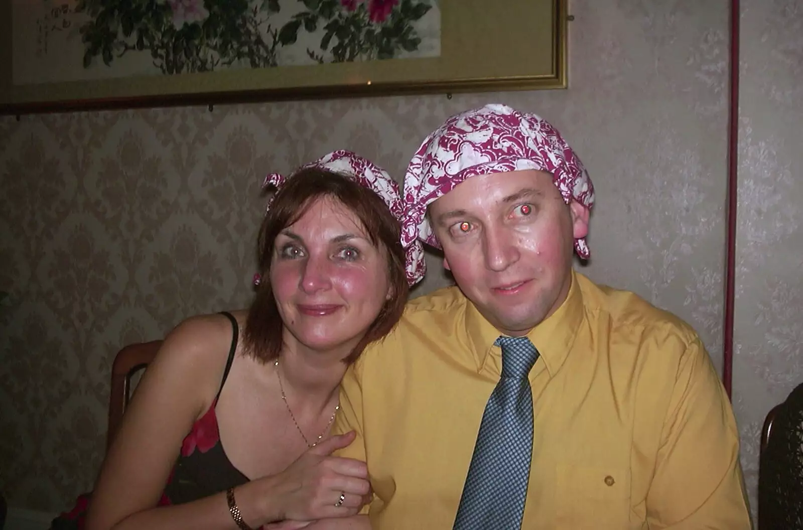 Anne and Nigel both have serviettes on their heads, from Anne's Satis House Night, Yoxford, Suffolk - 11th March 2003