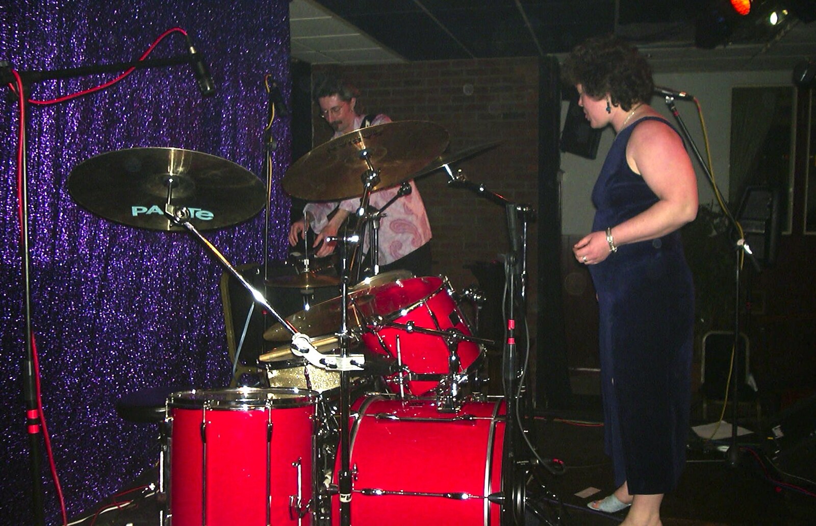 Jo stands in front of the drum kit from The BBs at Eye Town Hall, Eye, Suffolk - 21st March 2003