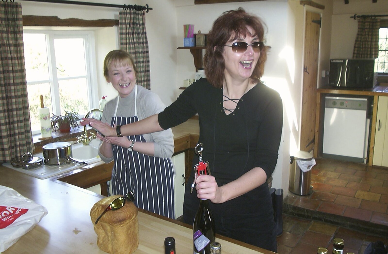 Anne cracks open a bottle of vino from Carolyn on Sunday, Wymondham, Norfolk - 23rd March 2003
