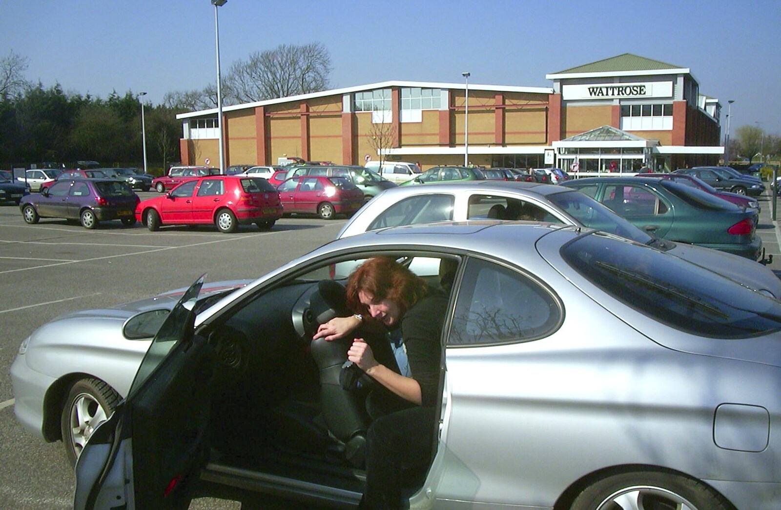 Carolyn on Sunday, Wymondham, Norfolk - 23rd March 2003: Anne squeezes out of the back of Carolyn's car