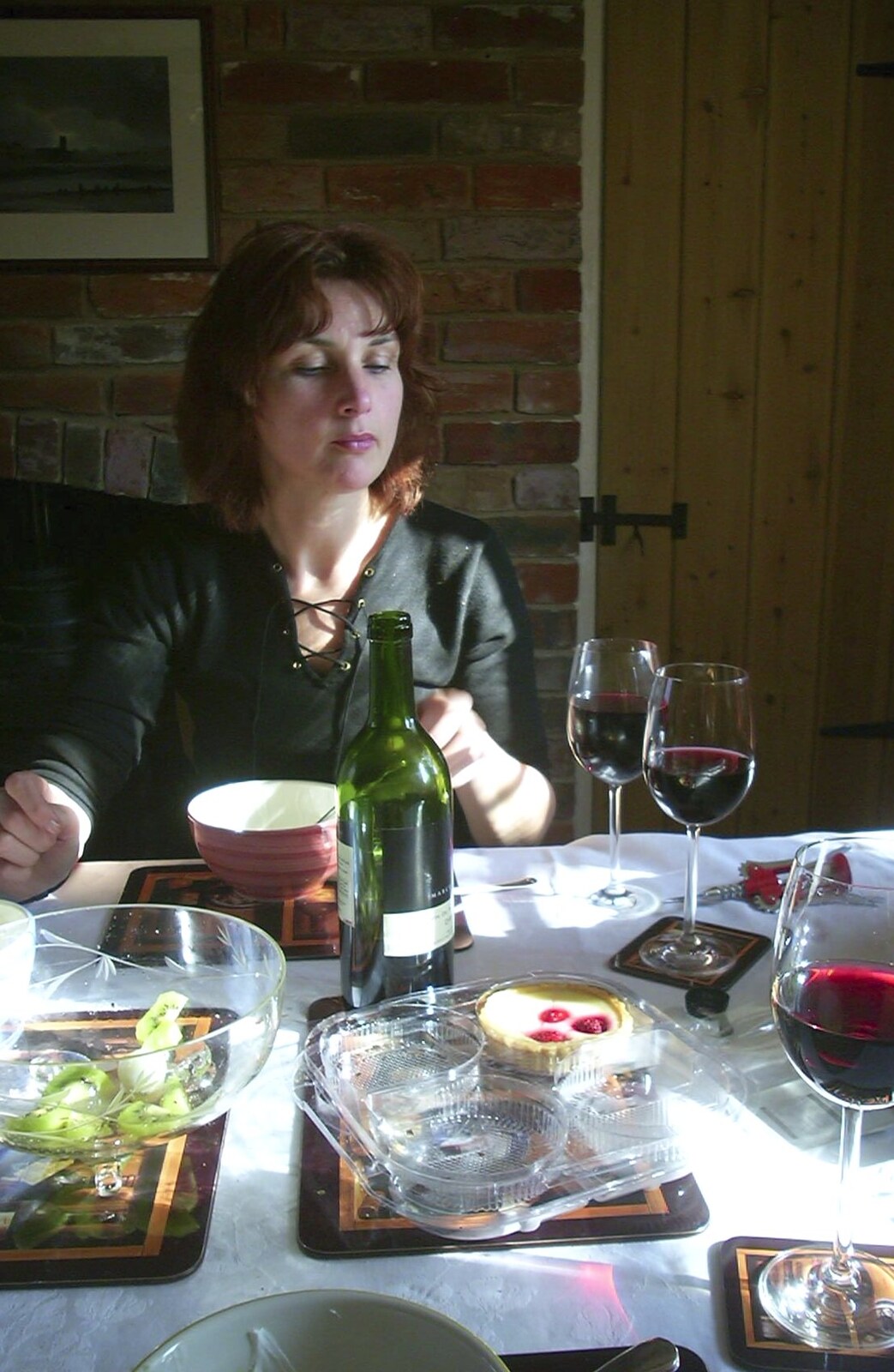 Anne surveys her two glasses of red wine from Carolyn on Sunday, Wymondham, Norfolk - 23rd March 2003