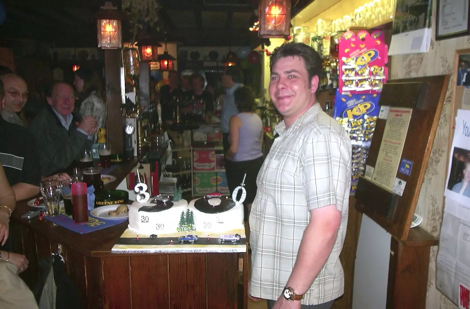 Neil stands by his cake, from Neil's 30th Birthday at the Swan Inn, Brome, Suffolk - 5th April 2003