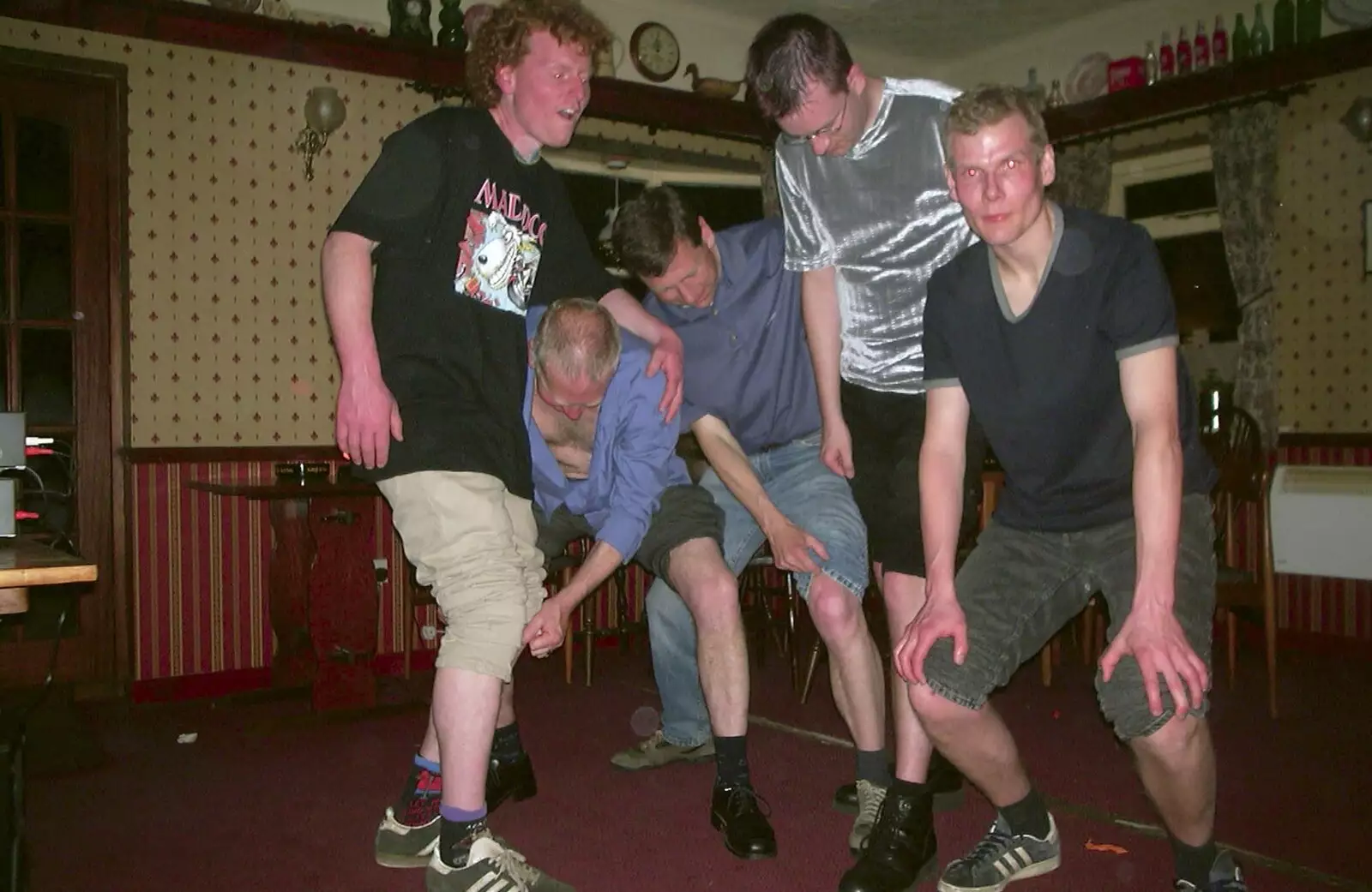 The lads get their knees out for some reason, from Neil's 30th Birthday at the Swan Inn, Brome, Suffolk - 5th April 2003