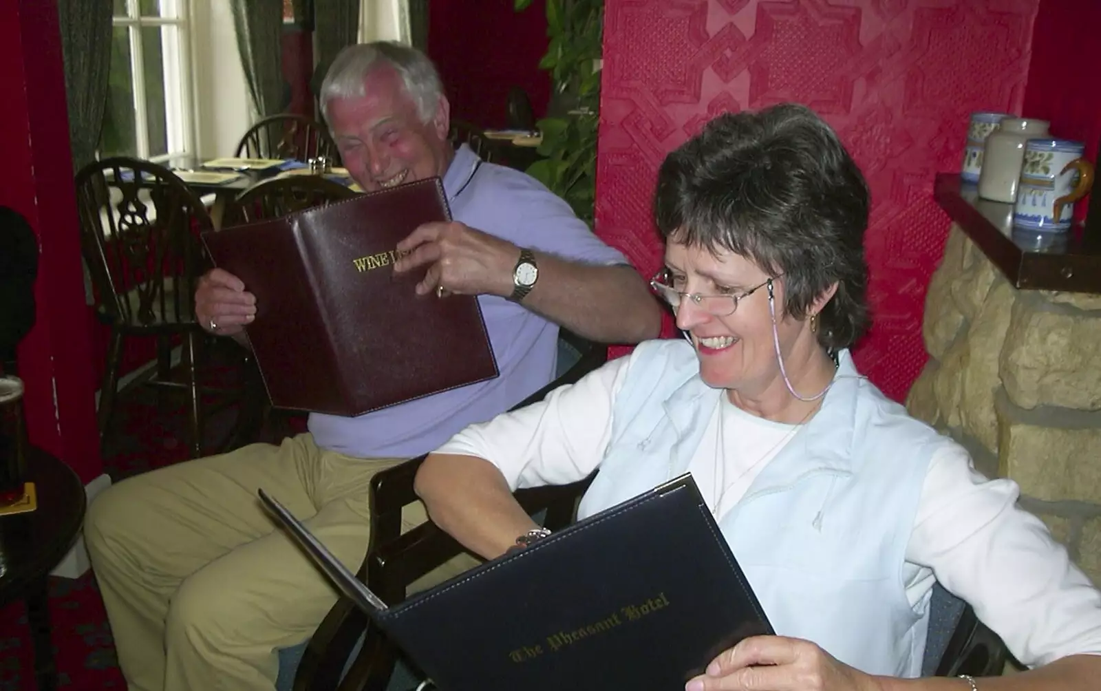 Colin and Jill have a look at the menu too, from The BSCC Bike Ride Weekend, Kelling, Norfolk - 9th May 2003