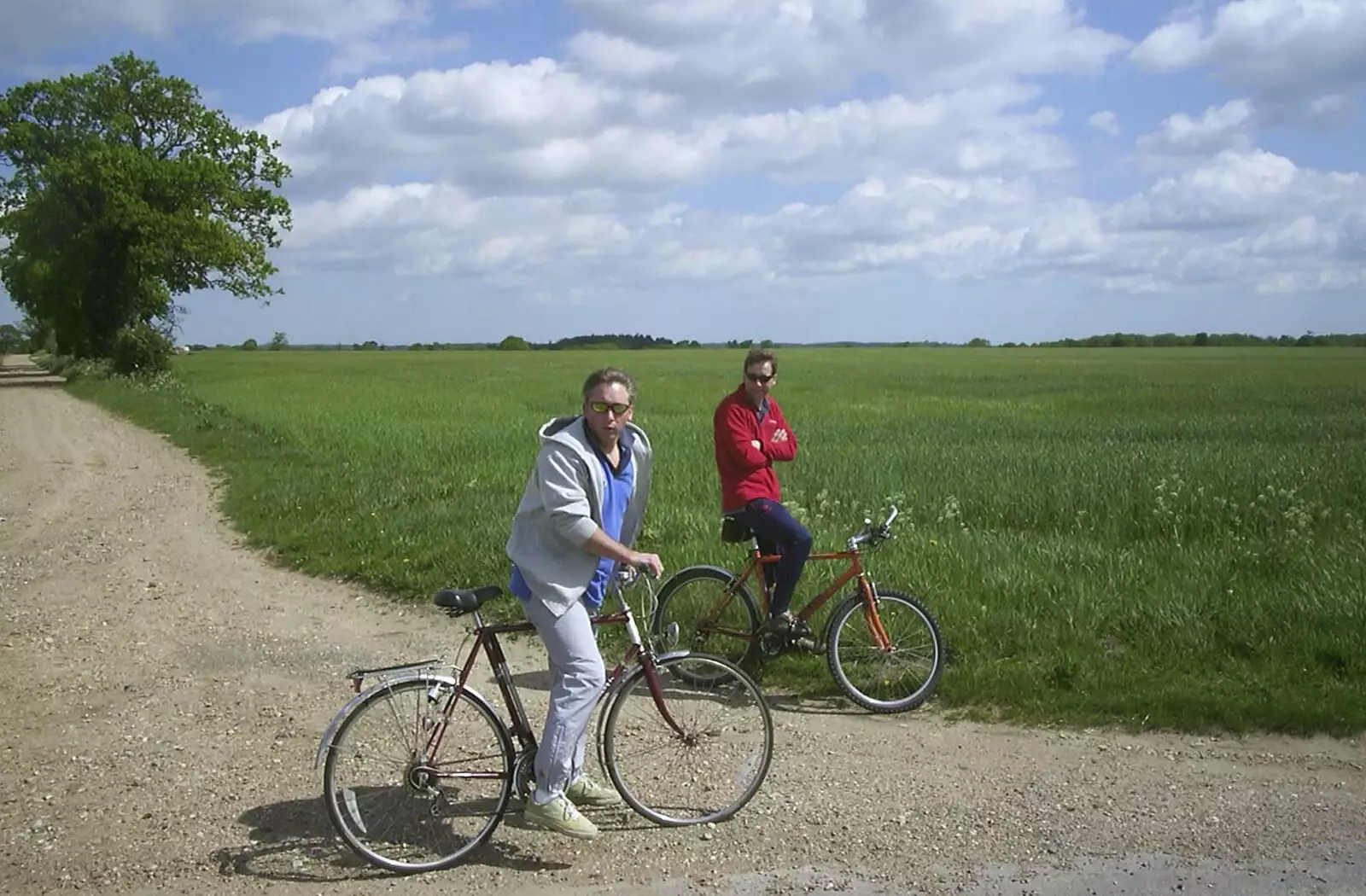 Nigel and Apple in a field, with a tree, from The BSCC Bike Ride Weekend, Kelling, Norfolk - 9th May 2003