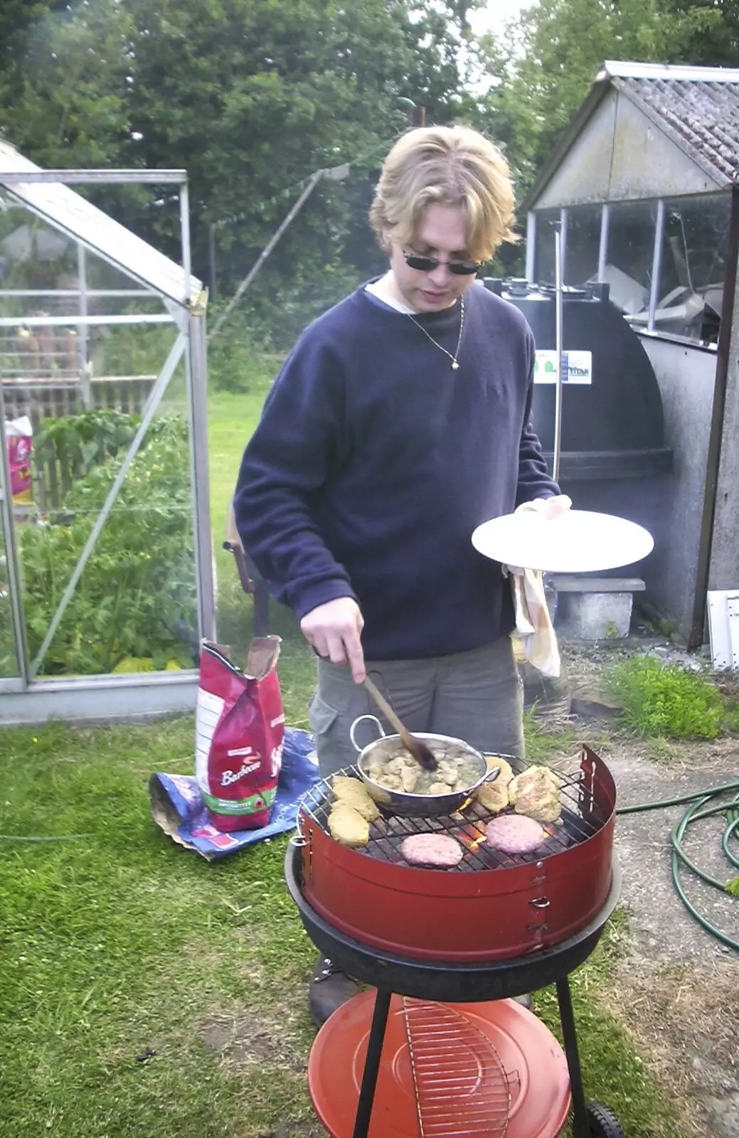 Marc pokes something on the barbeque, from 3G Lab at Henry's and a Barbeque, Brome, Suffolk - 21st June 2003