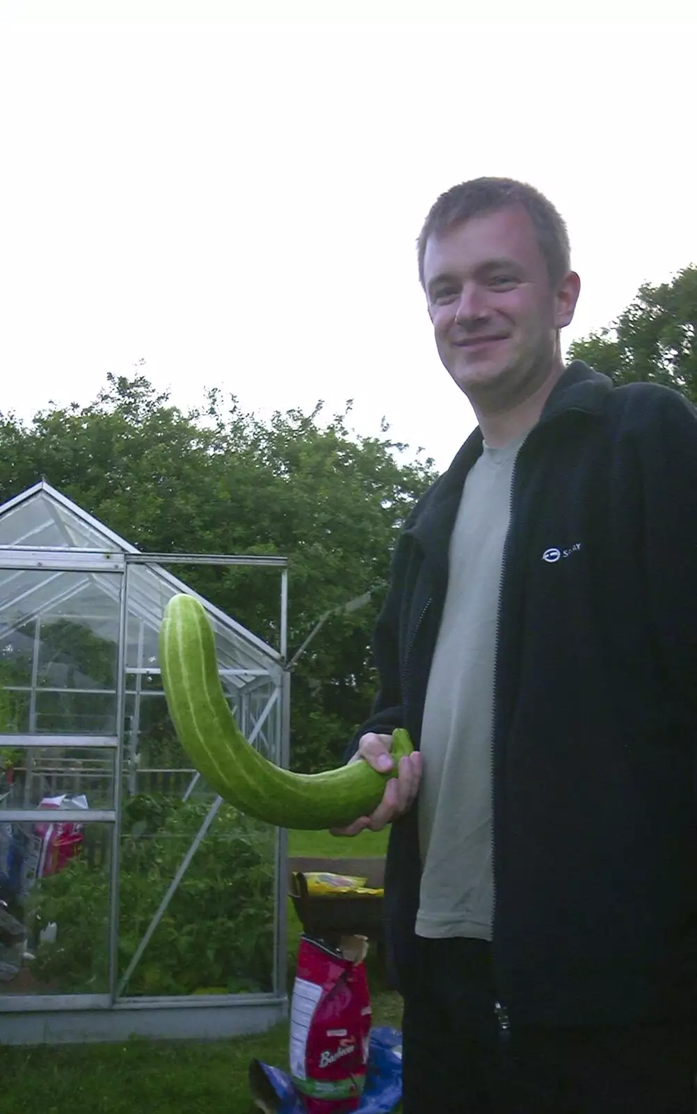 Nosher's got a cucumber out of the greenhouse, from 3G Lab at Henry's and a Barbeque, Brome, Suffolk - 21st June 2003