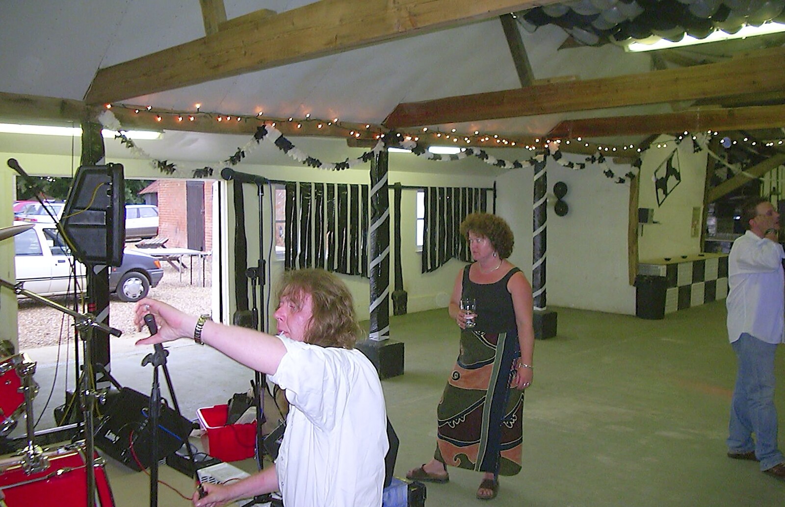 Max adjusts a mic stand as Jo waits from The BBs at Great Ellingham, Norfolk - 18th July 2003