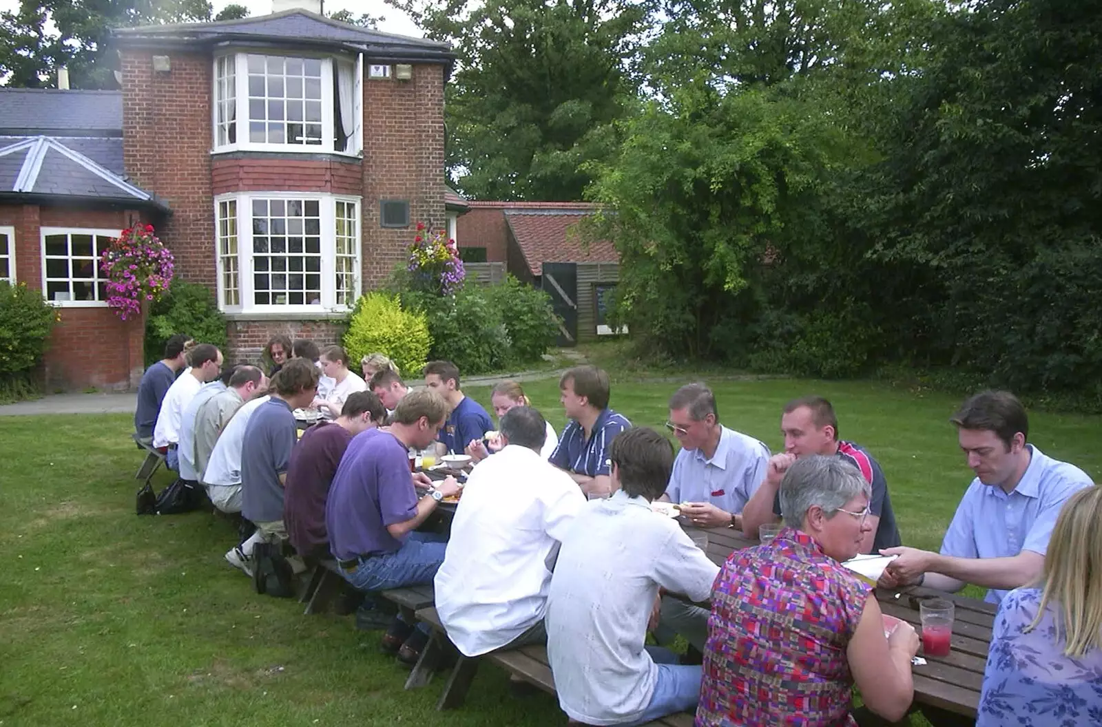 Trigenix, all on a very long table, from V Festival 2003, Hyland's Park, Chelmsford, Essex - 16th August 2003