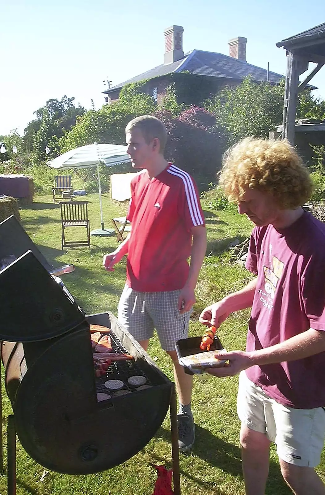 Wavy sticks some kebabs on the barbeque, from A Rabbit Barbeque, Dairy Farm, Thrandeston - 14th September 2003