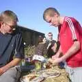 The Boy Phil looks warily at Bill's sausage, A Rabbit Barbeque, Dairy Farm, Thrandeston - 14th September 2003