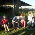 Alan tries to adjust the parasol, A Rabbit Barbeque, Dairy Farm, Thrandeston - 14th September 2003