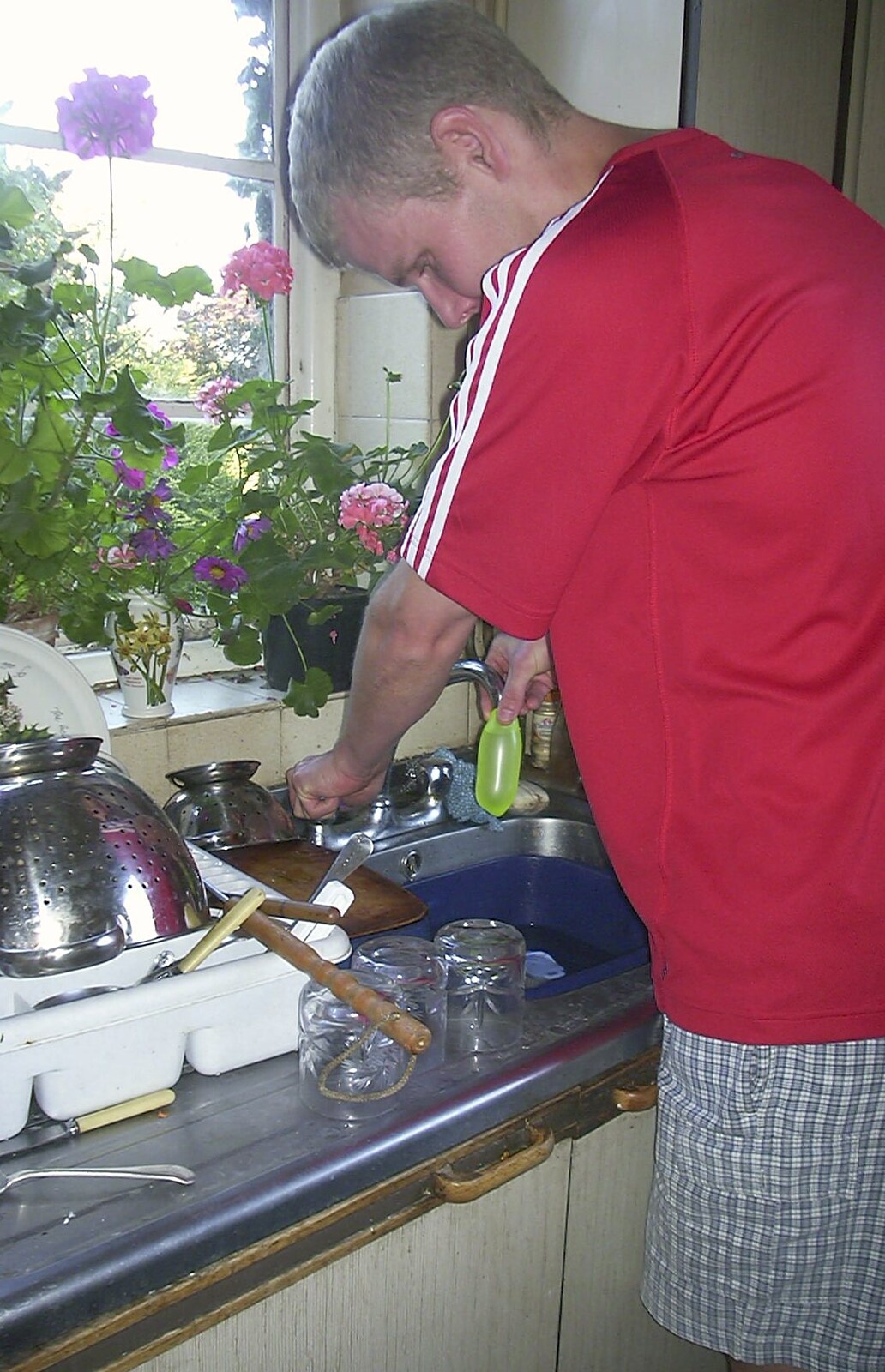 Bill prepares a water bomb from A Rabbit Barbeque, Dairy Farm, Thrandeston - 14th September 2003