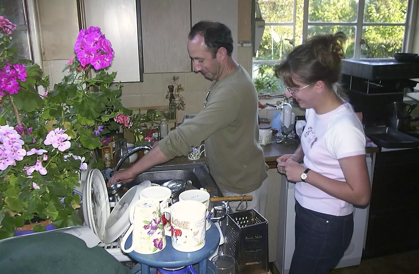 DH does some washing up, from A Rabbit Barbeque, Dairy Farm, Thrandeston - 14th September 2003