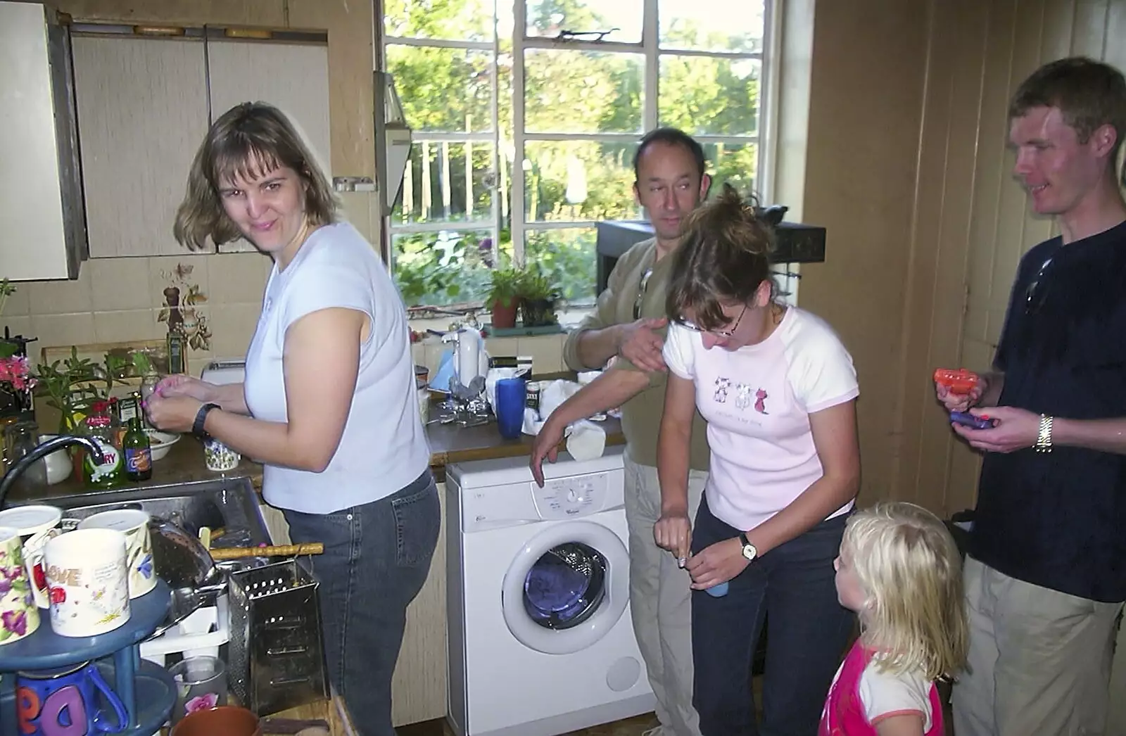 There's a queue to fill up water bombs, from A Rabbit Barbeque, Dairy Farm, Thrandeston - 14th September 2003