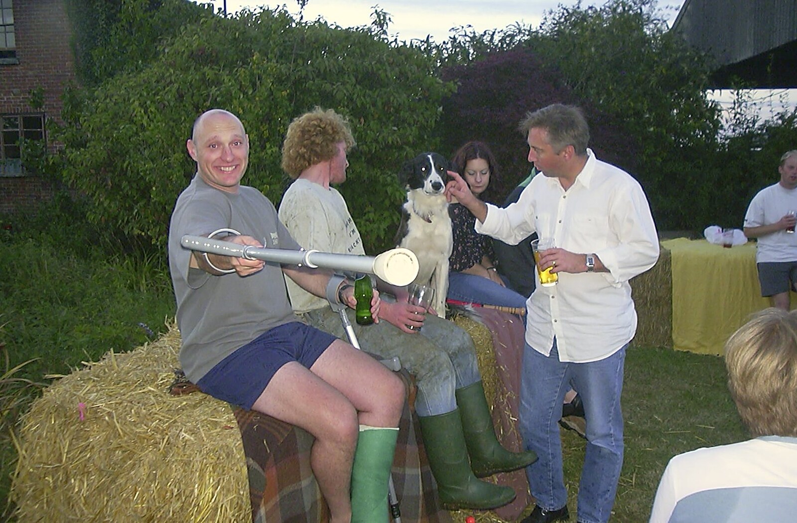 Gov brandishes a crutch from A Rabbit Barbeque, Dairy Farm, Thrandeston - 14th September 2003